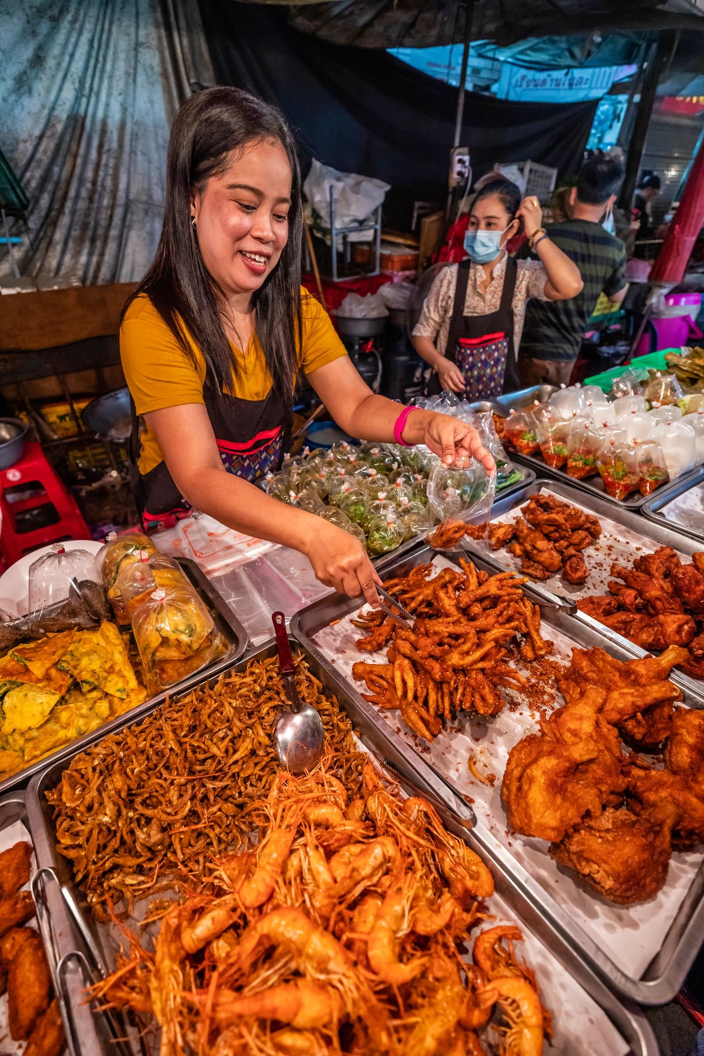 Thai street food vendors at a night market
