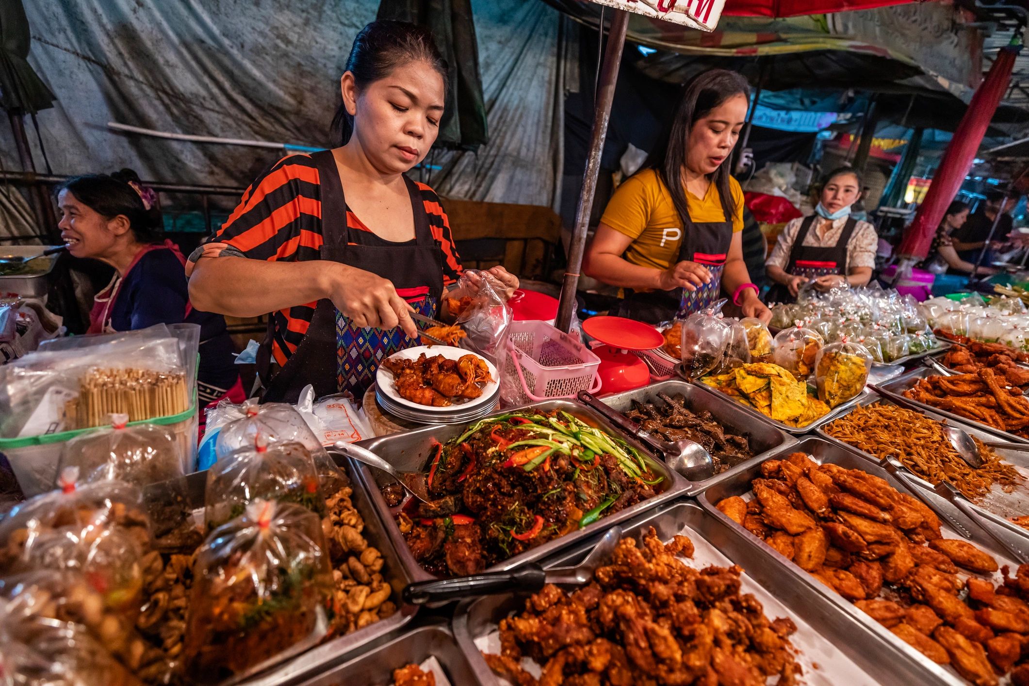 Thai street food sellers at a night market in Chiang Mai