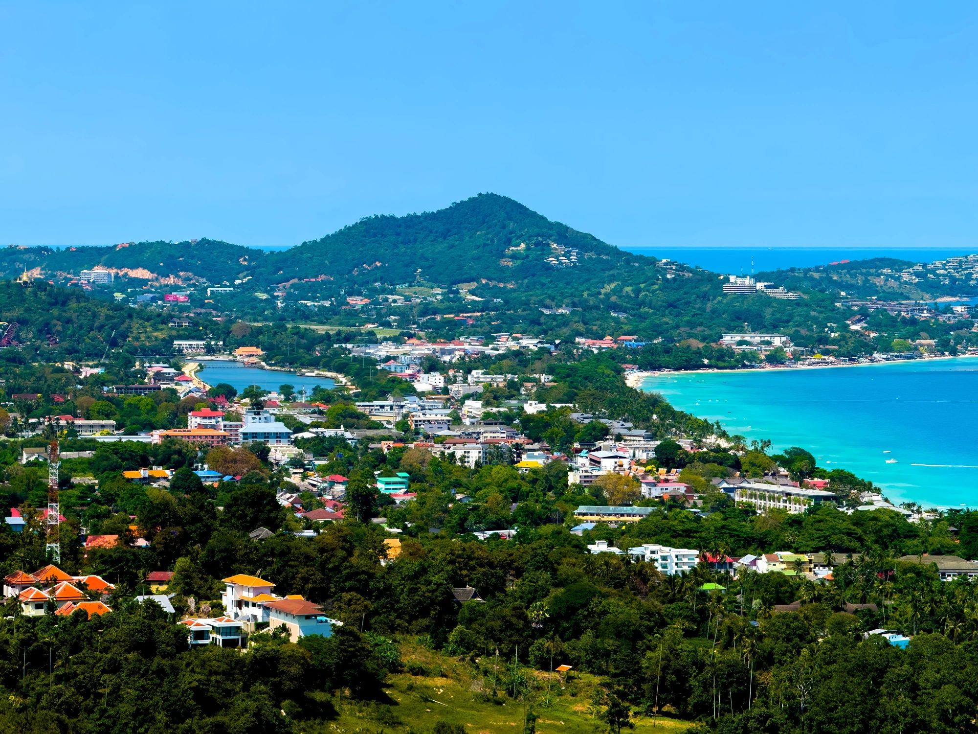 Coastal town and turquoise bay panorama