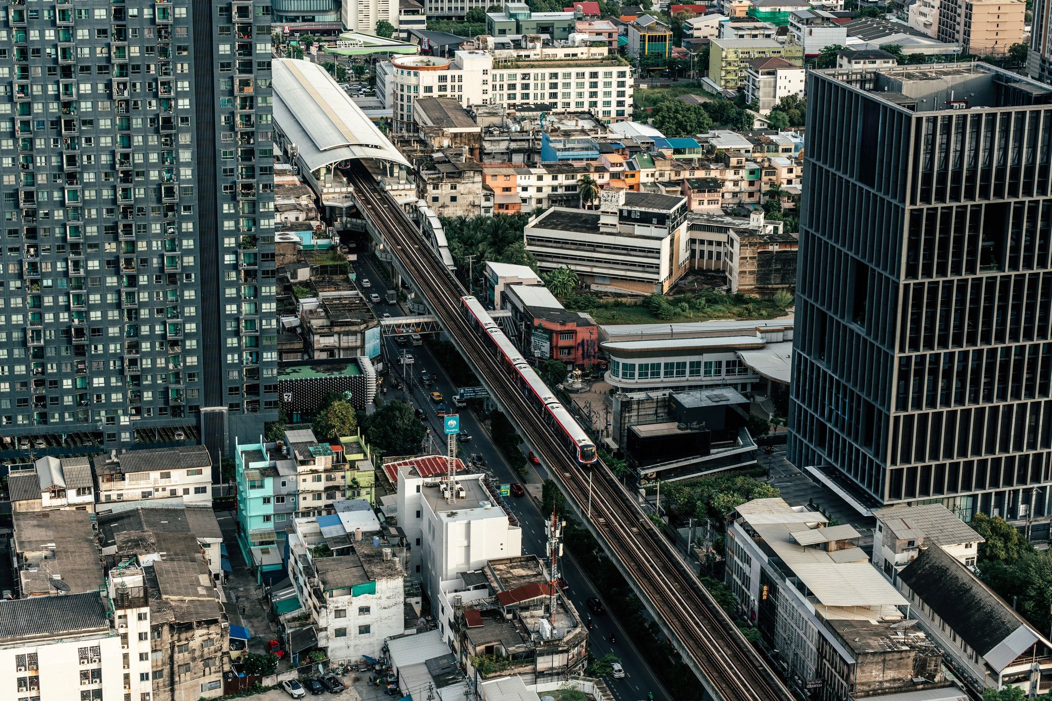 Bangkok BTS skytrain with city buildings