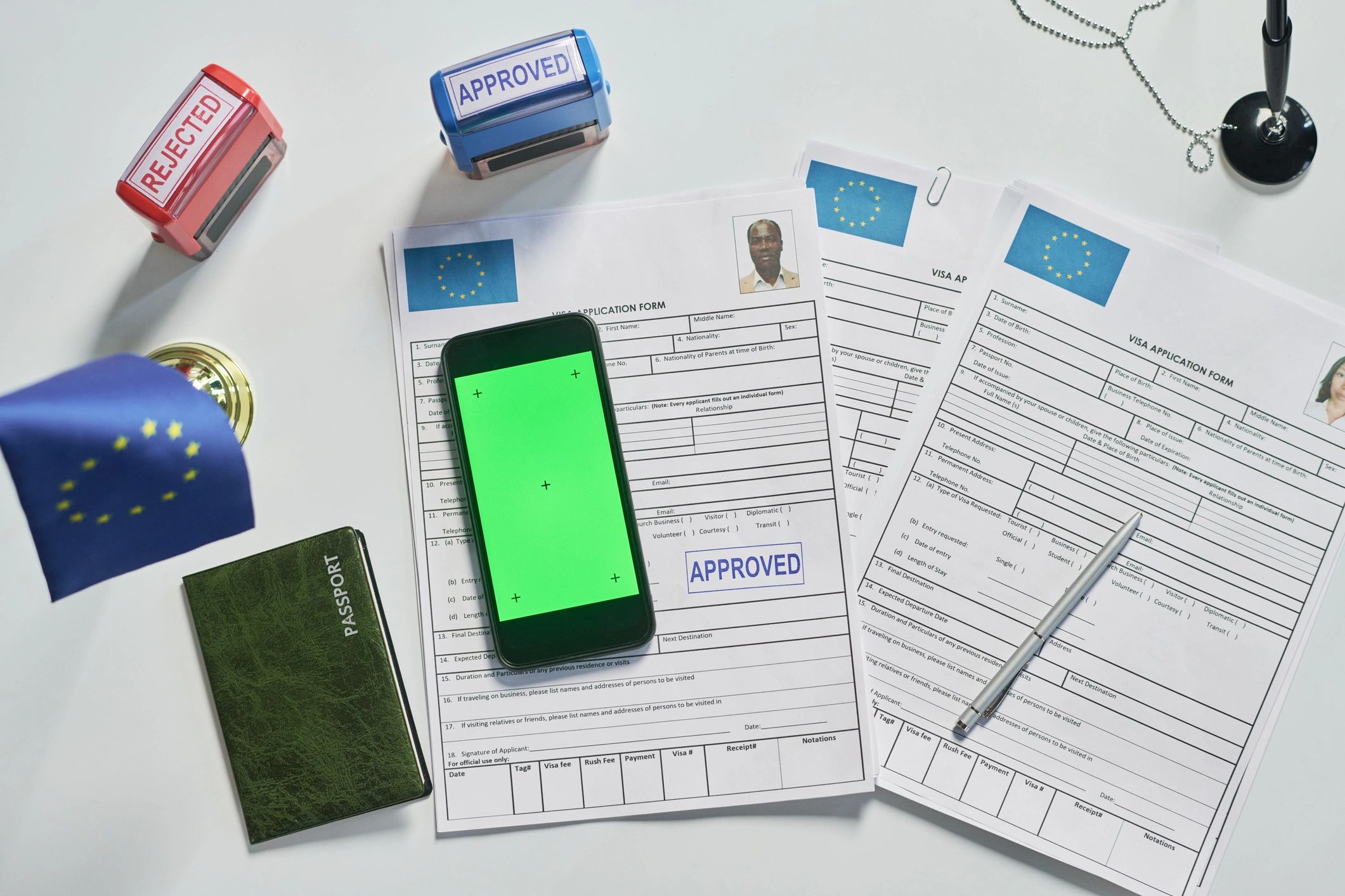 Passport and visa application documents on a desk