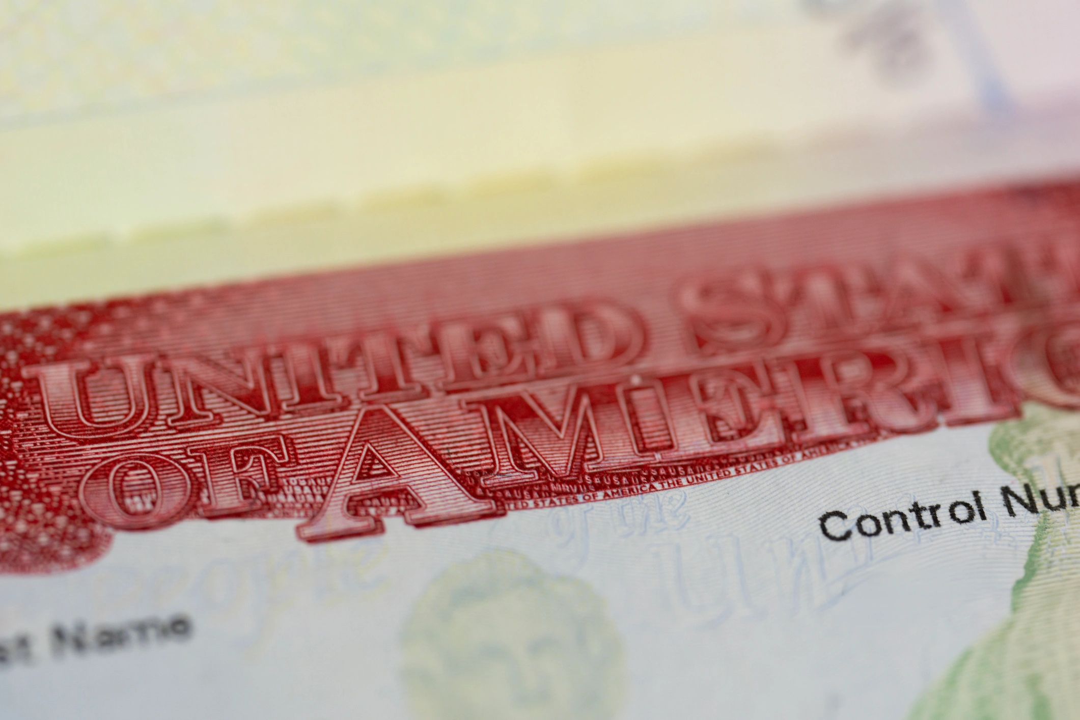 Close-up of a passport page with an immigration stamp